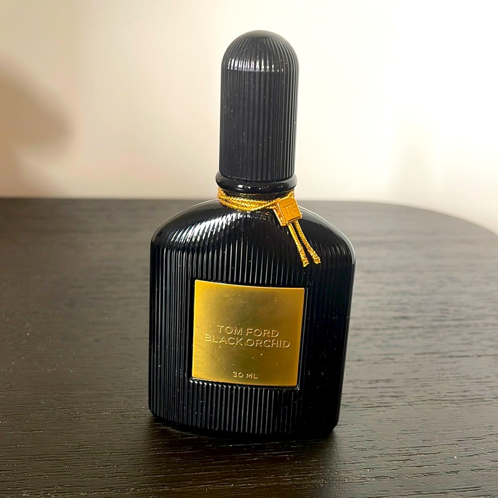 Partial bottle of Tom Ford Black Orchid Eau dr Parfum.